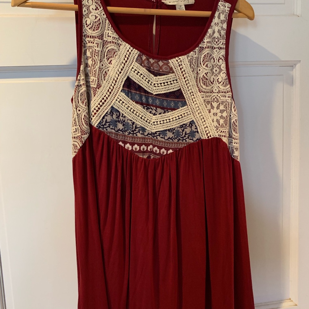Women’s burgundy knit top with crochet detail